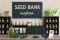 Seed bank with displayed seeds from well-known brands such as Sensi Seeds, Royal Queen Seeds or Silent Seeds, complete with Canatura logo